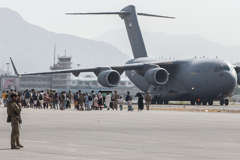 210821-M-GQ845-1035 HAMID KARZAI INTERNATIONAL AIRPORT, Afghanistan (August 21, 2021) Evacuees load on to a U.S. Air Force Boeing C-17 Globemaster III during an evacuation at Hamid Karzai International Airport, Kabul, Afghanistan, Aug. 21. U.S. service members are assisting the Department of State with an orderly drawdown of designated personnel in Afghanistan. (U.S. Marine Corps photo by Sgt. Samuel Ruiz).