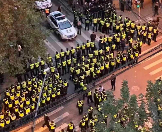 Police fortifying the intersection in Shanghai that became the rallying point of the protests Image fair use